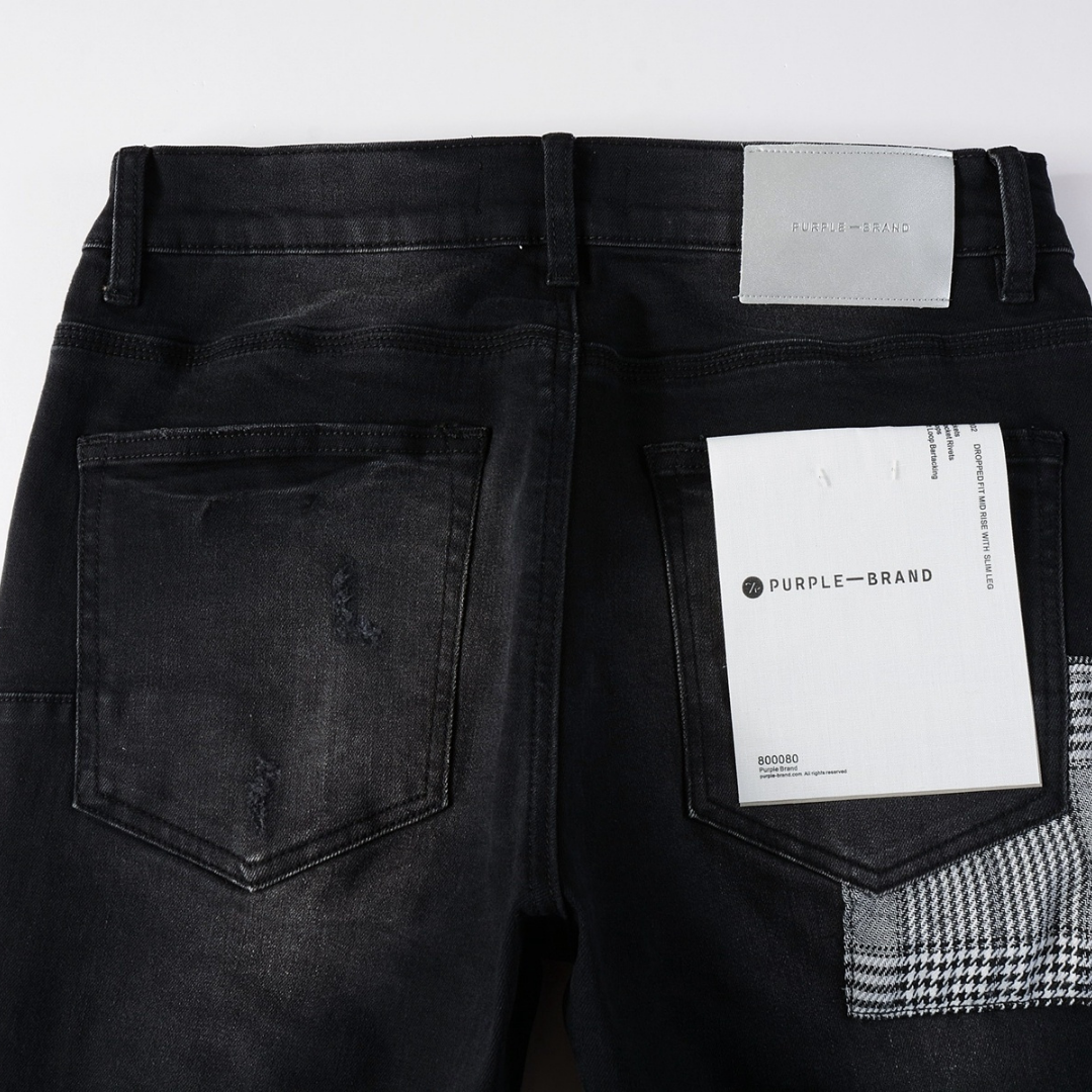 Jean déchiré à monogramme violet