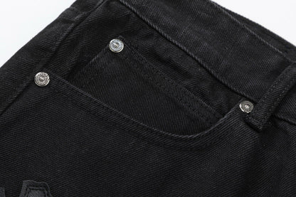Jean noir à double croix et cœurs chromés