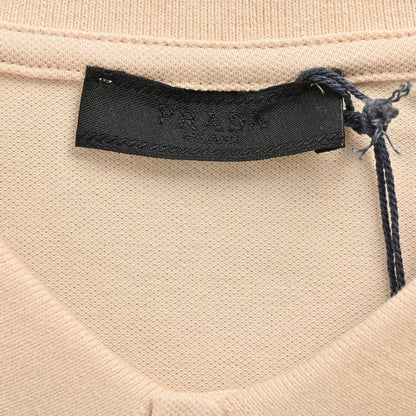 Polo beige à écusson logo Prada