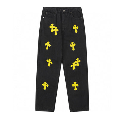 Jean noir à motif cœurs chromés et croix jaune