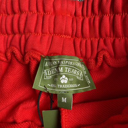 PANTALON DE SURVÊTEMENT ROUGE EN DENIM TEARS ET COTON AVEC COURONNE