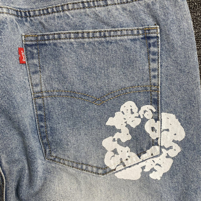 DENIM TEARS x LEVI'S COTTON WREATH JEANS DÉLAVAGE LÉGER