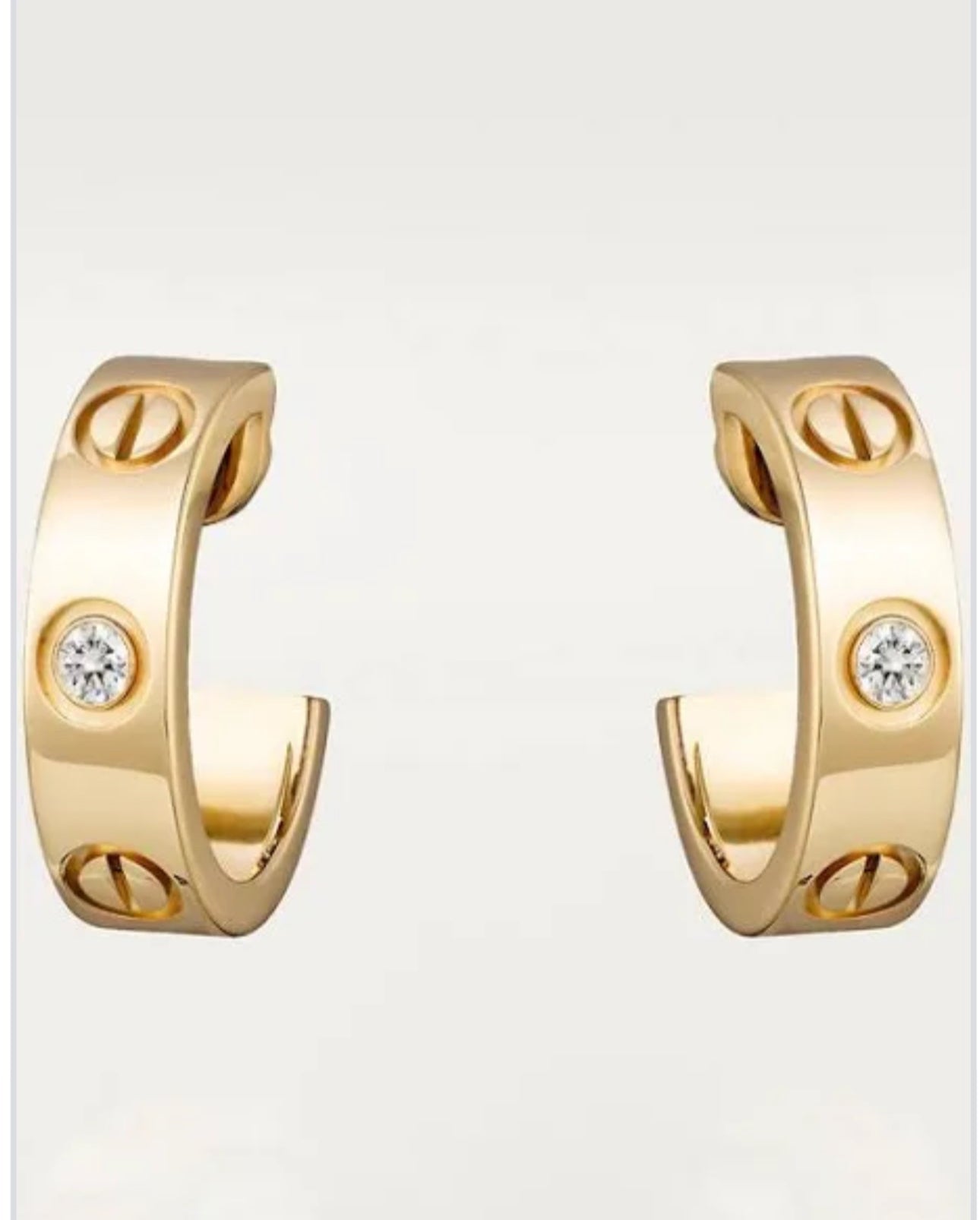Petites boucles d'oreilles Cartier en or et diamants
