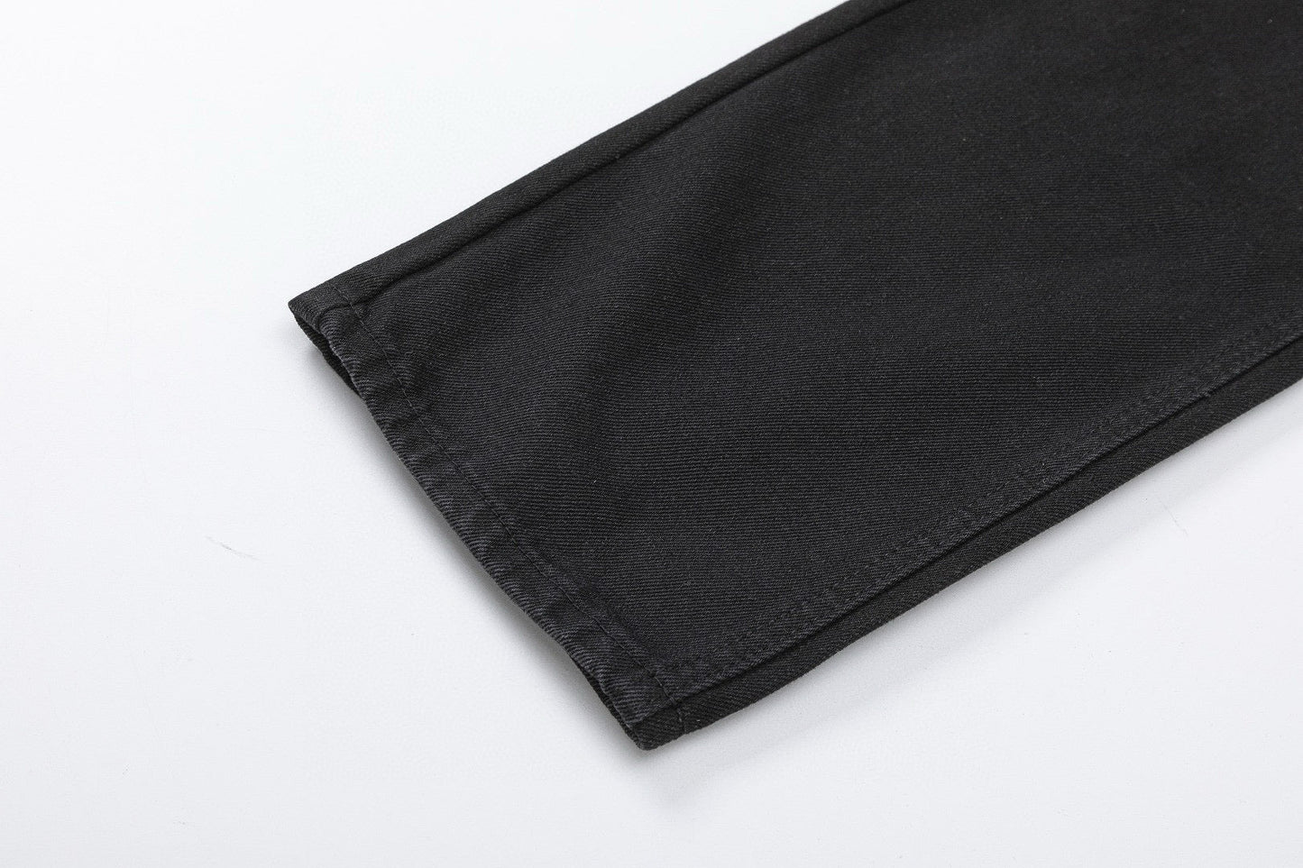 Jean noir à double croix et cœurs chromés