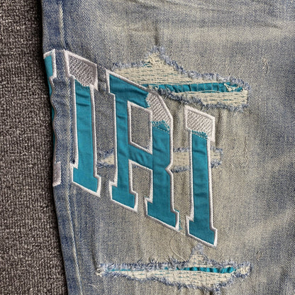 JEANS À LOGO UNIVERSITAIRE AMIRI