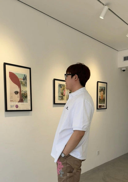 Polo blanc Balenciaga à logo BB