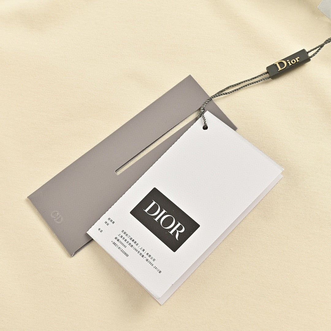 T-shirt crème Dior avec bordure noire