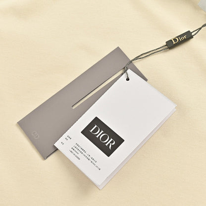 T-shirt crème Dior avec bordure noire
