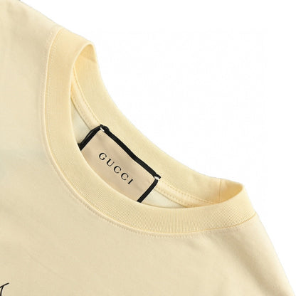 T-shirt Gucci avec logo vache de dessin animé (crème)