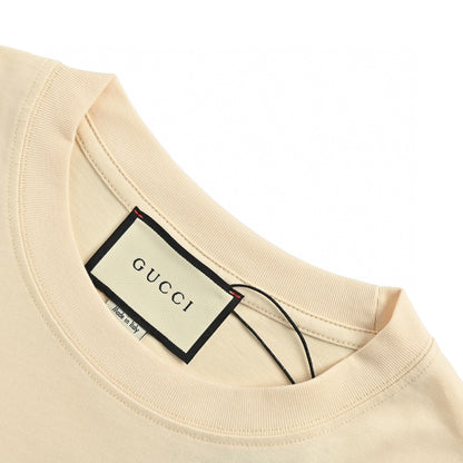 T-shirt Gucci à logo éclaboussé (beige)