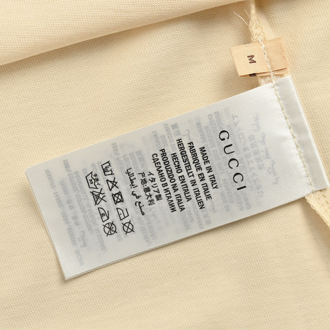 T-shirt Gucci à logo éclaboussé (beige)