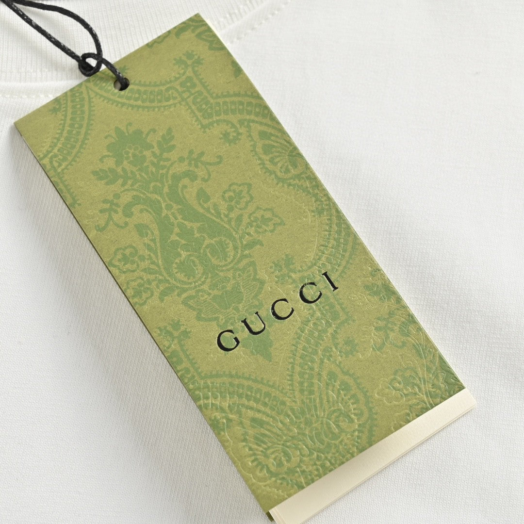 T-shirt blanc Gucci à motif dinosaure rose