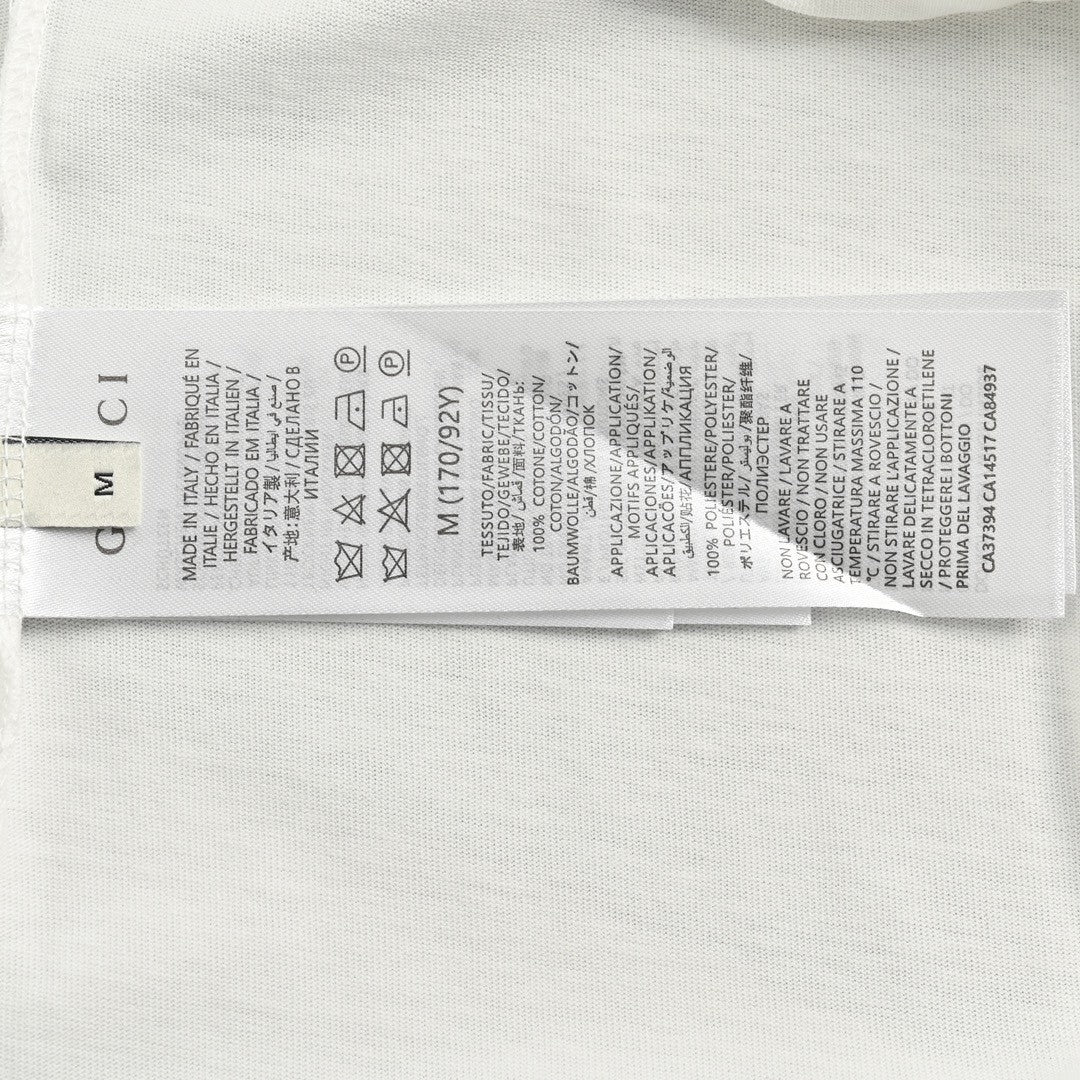 T-shirt blanc Gucci avec logo en écriture cursive