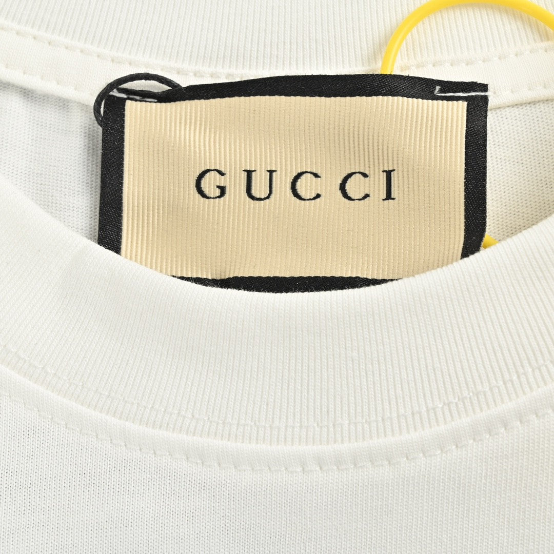 T-shirt blanc Gucci avec logo en écriture cursive