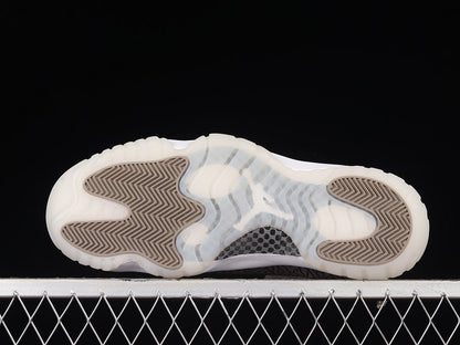 AIR JORDAN 11 RETRO LOW BLANC/BLEU UNIVERSITÉ