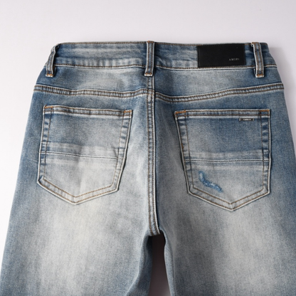 Jean déchiré à patch bleu Amr