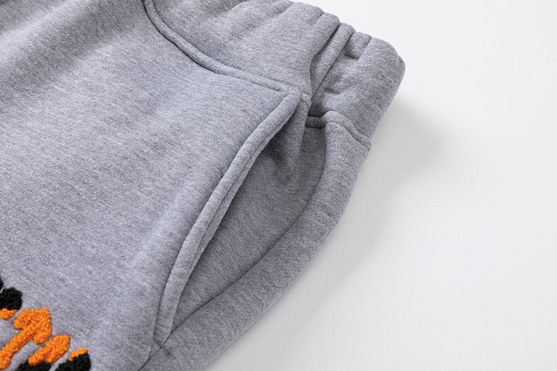 Survêtement gris orange décodé